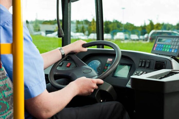 Bus driver sitting in his bus on tour